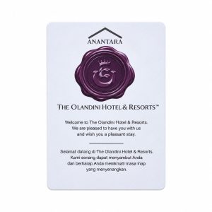 White Olandini Hotel and Resorts welcome key card with purple wax seal logo and multilingual greeting