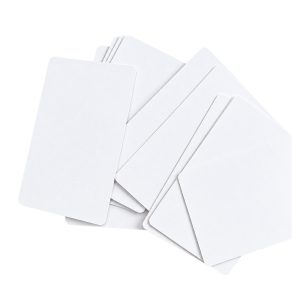 Blank white IC cards scattered flat showing both front and back