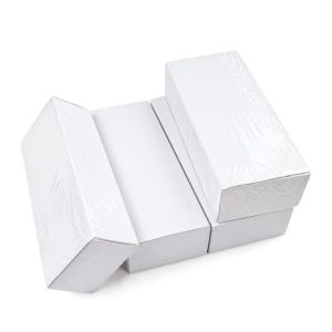 Blank white IC cards in shrink-wrapped boxes stacked together