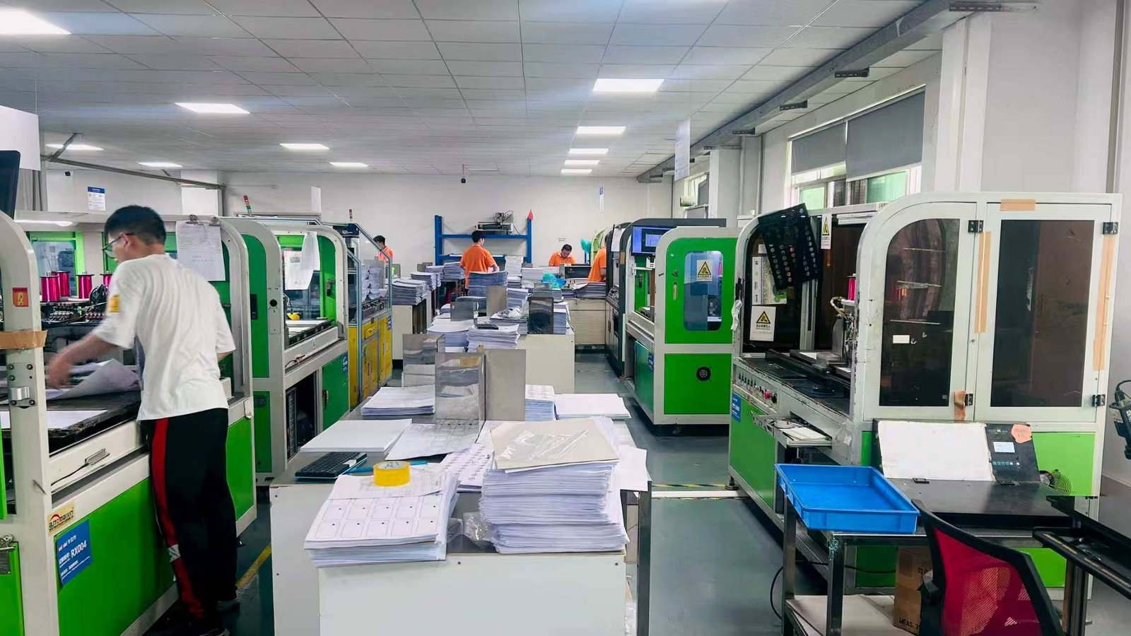 RFID product assembly lines with operators and testing equipment at LOZAVY