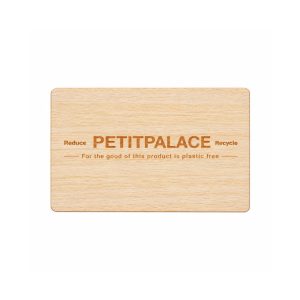 Light wood hotel key card with engraved Petit Palace logo