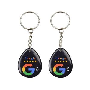 Two white Google G teardrop NFC epoxy key tags with ball chains
